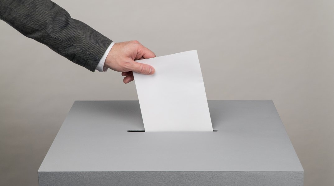gray-ballot-box-presidential-parliamentary-elections-voter-throws-ballot-into-box.jpg