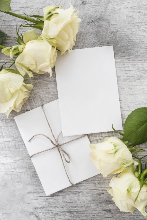 wedding-cards-with-roses-wooden-background.jpg