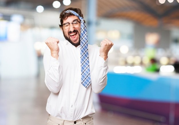 man-celebrating-with-his-tie-on-his-head_1154-69.jpg