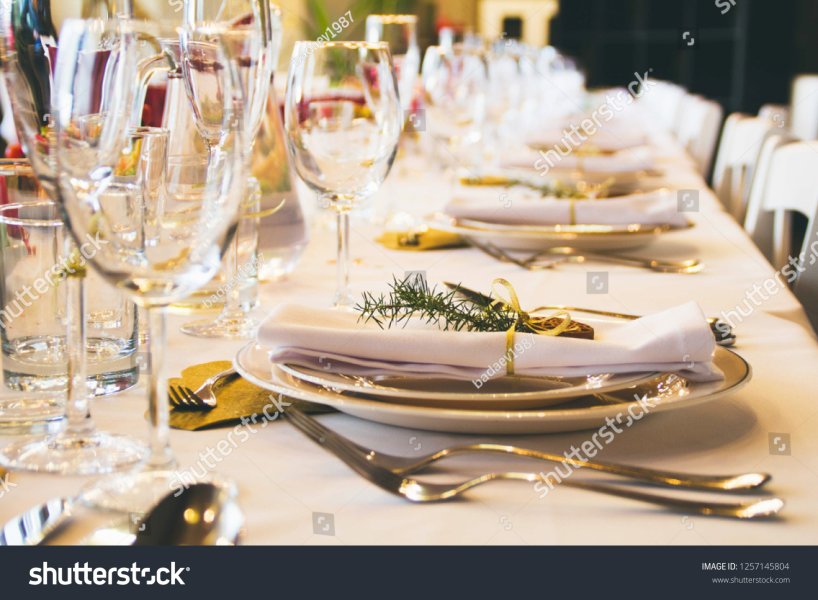 stock-photo-closeup-table-setting-in-restaurant-glasses-and-tableware-1257145804.jpg