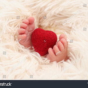 stock-photo-a-red-heart-between-the-legs-of-a-new-born-baby-1966955188.jpg