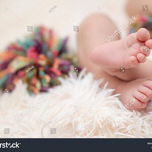 stock-photo-feet-of-a-newborn-baby-and-a-pompom-in-the-background-2049069323 (1).jpg