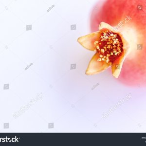 stock-photo-red-pomegranate-on-a-white-background-2195756245.jpg