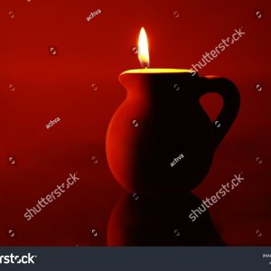 stock-photo-a-clay-urn-with-a-candle-lit-inside-2228708927.jpg